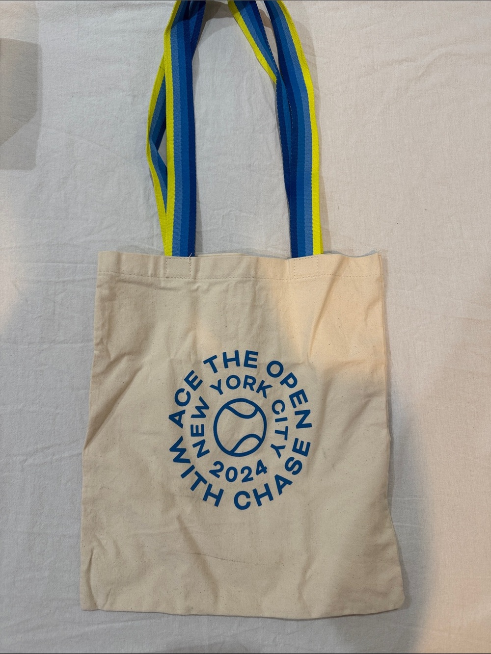 Canvas Tote Bag with Blue Logo and Striped Handles